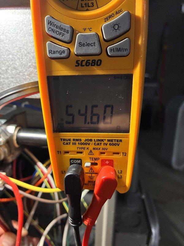 Completed comprehensive tune-up service on commercial furnace and air conditioning system, including installation of Air Bear 20x25x5 filter. Performed diagnostic testing with digital multimeter showing 546.0 reading on system components, and verified temperature measurements at 59°F using precision thermometer to ensure proper system operation and performance standards.