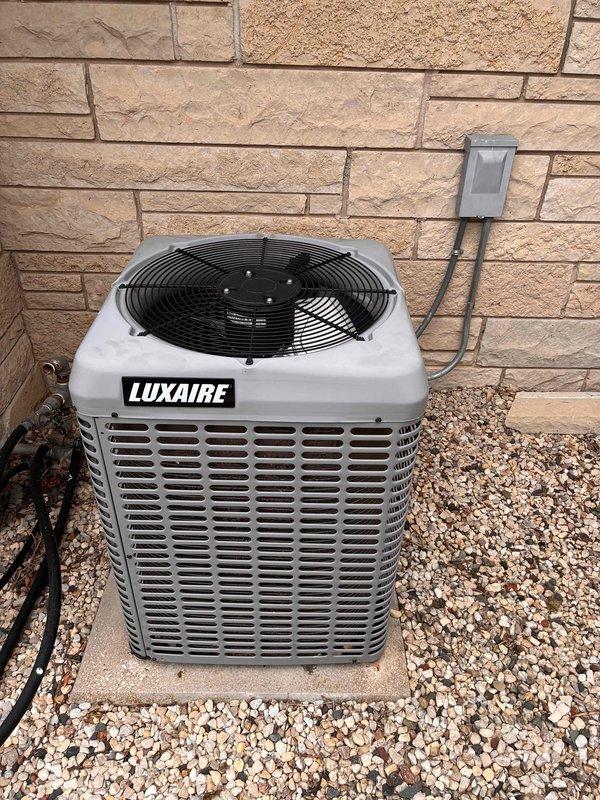 Completed comprehensive tune-up on commercial HVAC system including furnace and Luxaire air conditioning unit. Performed electrical diagnostics using digital multimeter, verifying proper voltage and amperage readings on system components. Installed new 20x25x4 Air Bear filter to maintain optimal indoor air quality and system efficiency. Inspected outdoor condensing unit, confirmed proper operation of condenser fan motor, and verified refrigerant line connections. All equipment tested and operating within manufacturer specifications upon completion.