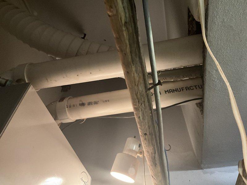Conducted estimate for boiler replacement on existing 20-year-old high-efficiency unit that is currently operational. System includes extensive copper manifold piping with multiple zone valves and does not have an indirect water heater tank. Assessed existing white wall-mounted boiler with digital display panel, associated circulator pumps, and zone control components mounted in basement mechanical room. Evaluated current piping configuration, electrical connections, venting system, and overall installation layout to provide replacement recommendations and specifications for new high-efficiency boiler system.
