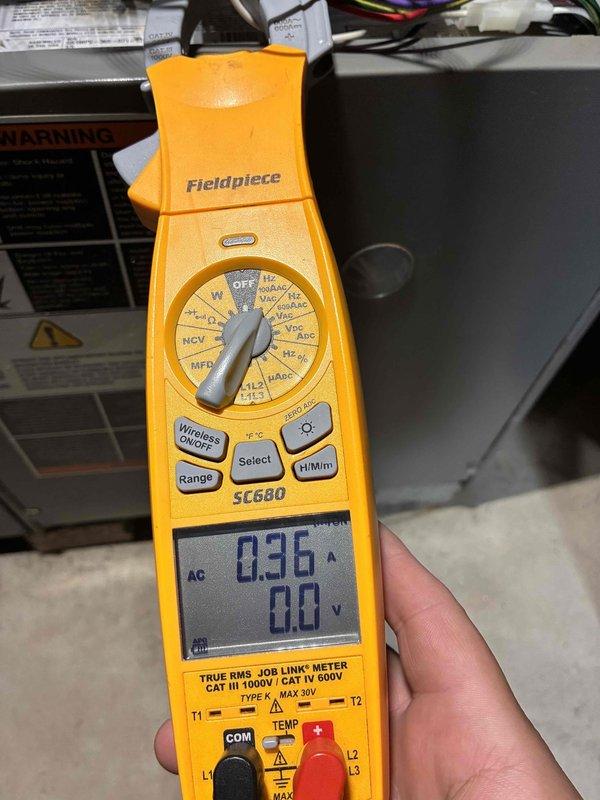 Completed furnace tune-up and safety inspection on residential HVAC system. Performed electrical diagnostics using calibrated multimeter, measuring amperage draw at 0.36A and verifying voltage readings to ensure proper system operation. Conducted temperature differential testing with readings of 56.98°F to confirm adequate heat exchanger performance and airflow. All electrical connections tested and verified within manufacturer specifications, system operating safely and efficiently.