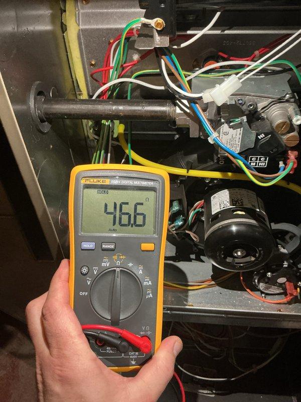 Completed scheduled heating maintenance visit on residential HVAC system. Performed electrical diagnostics using digital multimeter, obtaining readings to verify proper system operation and component functionality. Accessed furnace compartment to inspect internal components including blower assembly, motor, gas valve, control wiring, and associated electrical connections. All components found operating within normal parameters and system tested successfully upon completion.