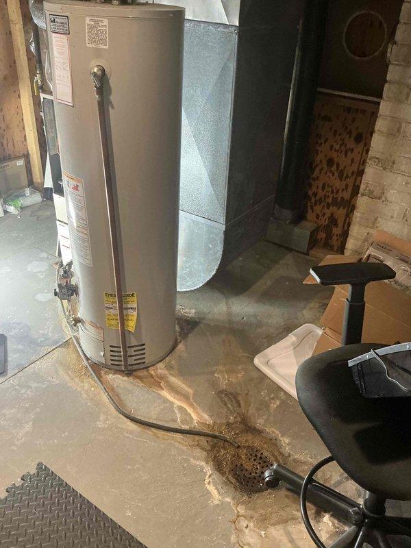 Responded to emergency service call for furnace and air conditioning system evaluation. Upon arrival, conducted thorough assessment of existing HVAC equipment in basement mechanical room. Inspected gas furnace with access panel open to evaluate internal components, burners, and overall system condition. Examined air conditioning system and associated ductwork. Documented equipment age, condition, and operational status through detailed photography. Noted water heater proximity and basement environmental conditions including floor staining. Provided comprehensive replacement estimate for both heating and cooling systems based on equipment assessment and customer needs.