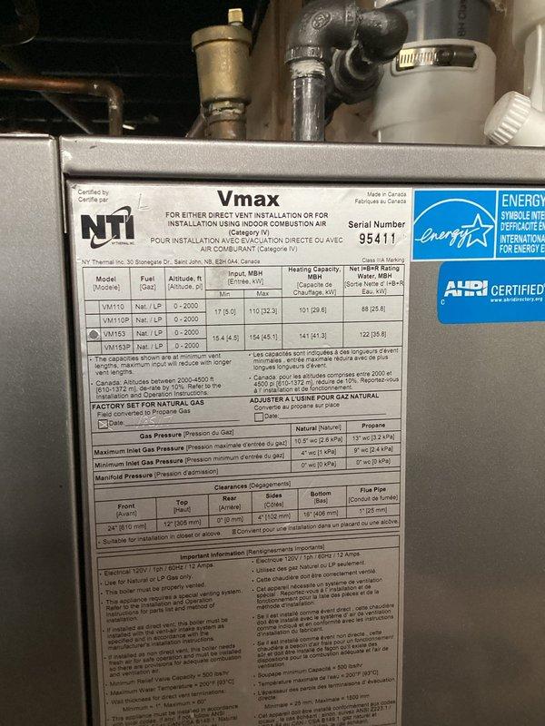 Responded to service call and diagnosed failed blower assembly on NTI Vmax high-efficiency boiler unit. Removed defective centrifugal blower housing with damaged impeller wheel and replaced with new OEM assembly. Verified proper mounting, tested unit operation, and confirmed system returned to normal heating function.