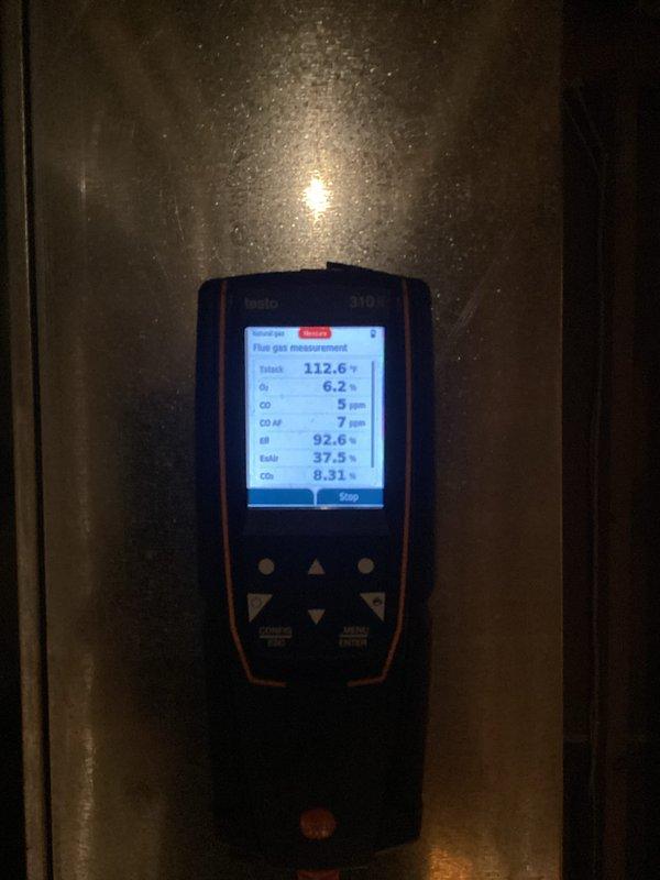 Completed preventive maintenance tune-up on gas furnace system and replaced two Air Bear filters (20x25x5). Performed combustion analysis using digital flue gas analyzer, confirming optimal system performance with stack temperature of 112.6°F, oxygen level at 6.2%, carbon monoxide reading of 5 ppm, and efficiency at 92.6%. All readings within manufacturer specifications, indicating proper burner operation and heat exchanger function.