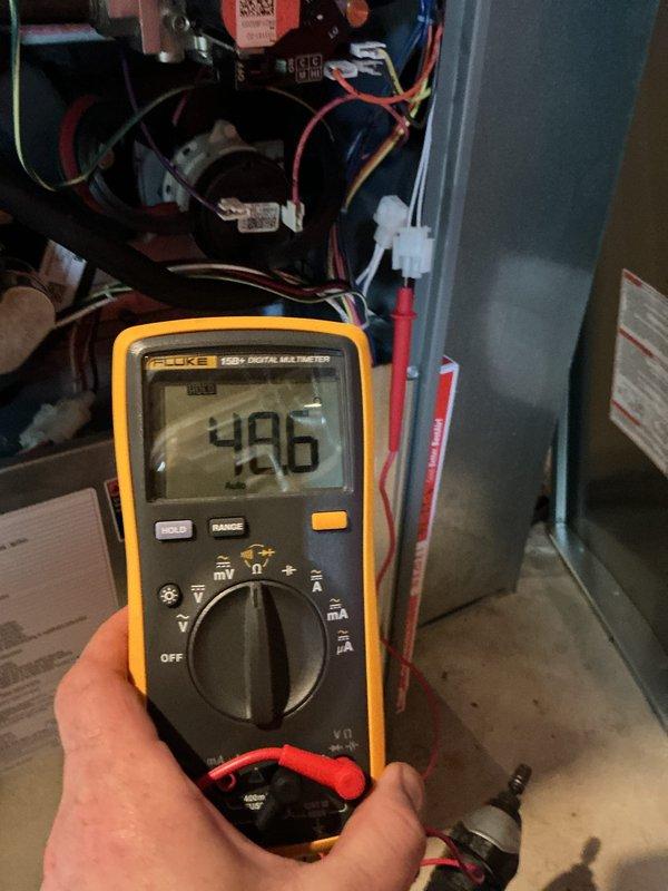 Completed comprehensive furnace tune-up and system diagnostics. Performed electrical testing using digital multimeter, confirming proper voltage readings at 496V on system components. Inspected air filter bank assembly, verified all pleated filters are clean and properly seated within the diagonal configuration housing, ensuring optimal airflow and system efficiency.