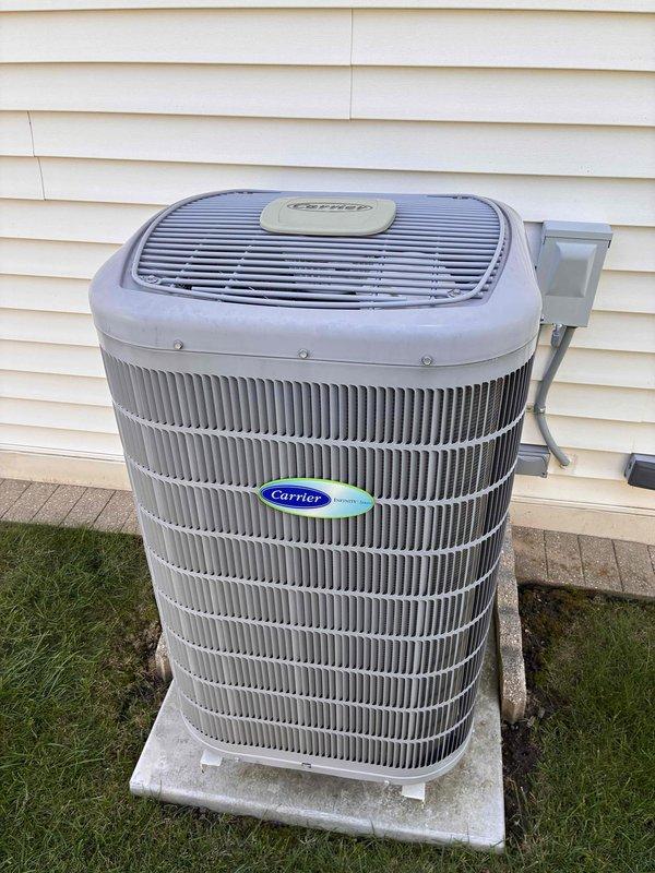 Completed annual cooling tune-up maintenance visit on Carrier air conditioning system as part of recurring family membership service. Performed comprehensive system inspection, verified condenser unit operation, checked refrigerant levels, cleaned condenser coils, tested electrical connections at disconnect box, and confirmed proper airflow through all components. Unit found in good operating condition with no repairs needed at this time.