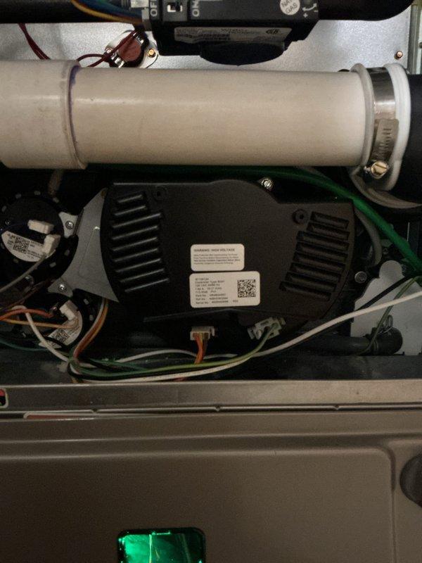Responded to no heat call on recently installed warranty equipment. Upon arrival, inspected internal components of HVAC system including blower motor assembly, electrical connections, and condensate drainage line. Verified all wiring connections were secure, control board functioning properly, and blower motor operational. System components appeared properly installed with appropriate wire management and mounting. Confirmed unit restored to normal heating operation.