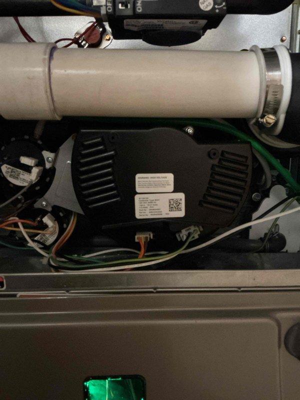 Responded to no heat call on recently installed warranty equipment. Upon arrival, inspected internal components of HVAC system including blower motor assembly, electrical connections, and condensate drainage line. Verified all wiring connections were secure, control board functioning properly, and blower motor operational. System components appeared properly installed with appropriate wire management and mounting. Confirmed unit restored to normal heating operation.