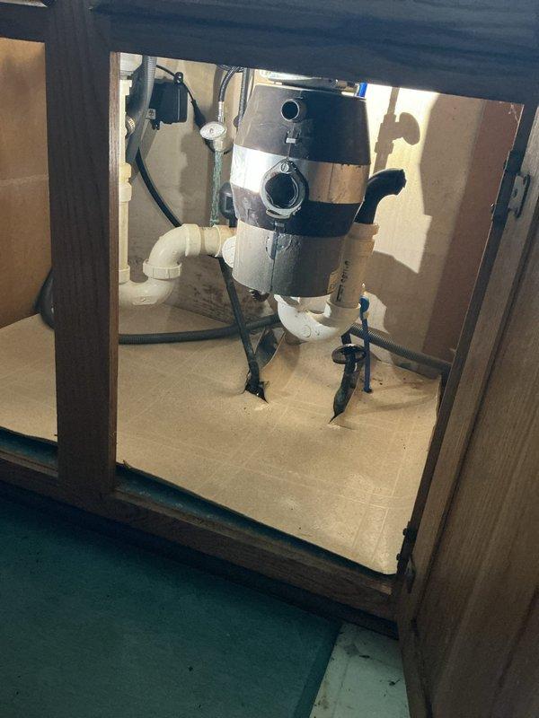 Installed customer-supplied garbage disposal unit under kitchen sink. Completed all necessary plumbing connections, verified proper drainage function, and ensured secure mounting of the disposal unit to the sink assembly.