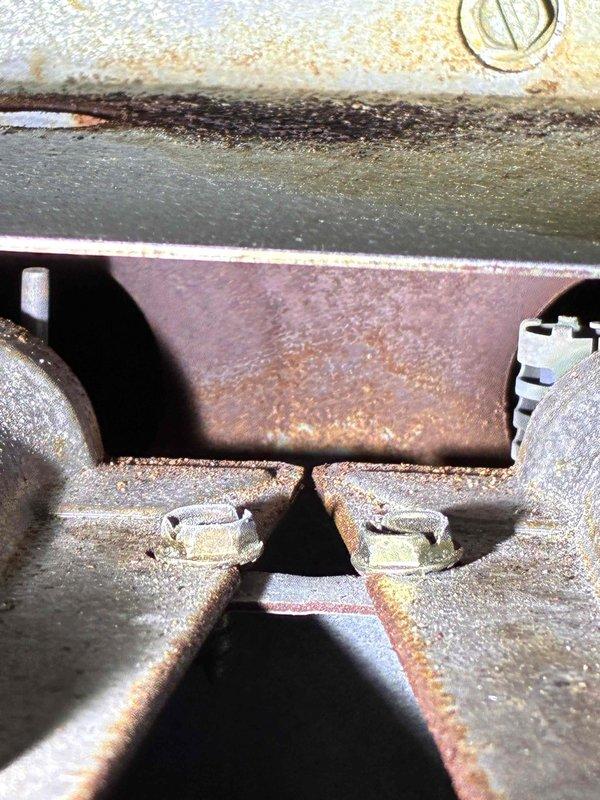 # HVAC Service Report

Responded to service call for non-operational furnace. Upon inspection, discovered extensive rust and corrosion throughout the unit's internal components, including metal brackets, mounting hardware, and housing panels. The evaporator coil sections showed significant deterioration with accumulated debris between aluminum fins and visible compression damage. Metal surfaces exhibited severe oxidation from prolonged moisture exposure, with rust penetration affecting structural integrity of critical components. Documented equipment condition with photographic evidence showing advanced corrosion on mounting brackets, deteriorated painted surfaces, and compromised coil assemblies. Unit condition indicates extended exposure to humidity and moisture, resulting in widespread component degradation that has impacted system functionality.