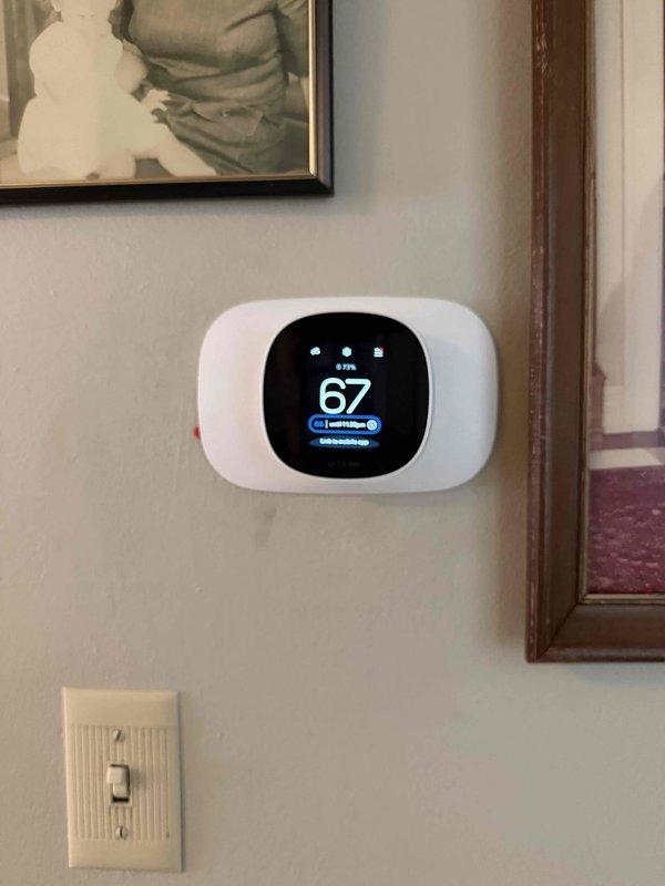 Completed Unico system installation with all required permits obtained and electrical work coordinated. Installed new ecobee smart thermostat with WiFi connectivity, programmed system settings, and verified proper operation with temperature display reading 67°F. All equipment tested and operational upon completion.