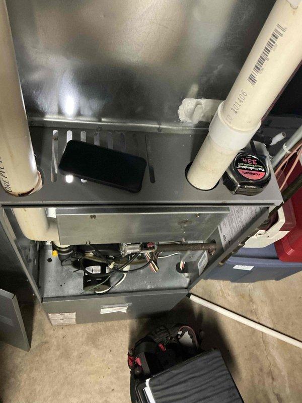 Conducted on-site assessment for gas furnace replacement. Evaluated existing HVAC system installation, documented current equipment configuration including furnace unit, PVC venting system, electrical connections, and control components. Photographed equipment specifications, mechanical room layout, and existing infrastructure to prepare comprehensive replacement estimate.