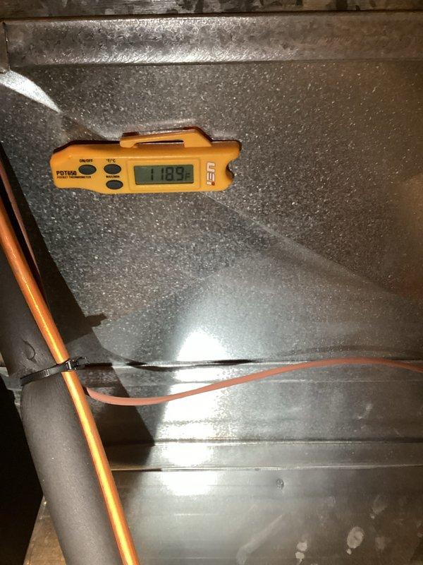 Completed preventative maintenance tune-up on gas-fired HVAC system. Removed access panel to inspect internal components including heat exchanger, blower motors, gas valve assembly, electrical connections, and ductwork. Verified supply air temperature at duct system reading 71.93°F and confirmed proper airflow through metallic ductwork. All mechanical and electrical components inspected and found operating within normal parameters.