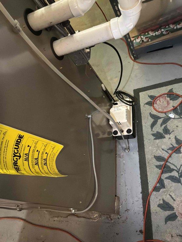 Performed estimate for furnace replacement after diagnosing failed heat exchanger in existing unit. Inspected current HVAC system including air handler cabinet, control components, and PVC venting configuration. Documented equipment condition and specifications from manufacturer label, assessed electrical connections and drainage system, and photographed installation for replacement planning purposes.