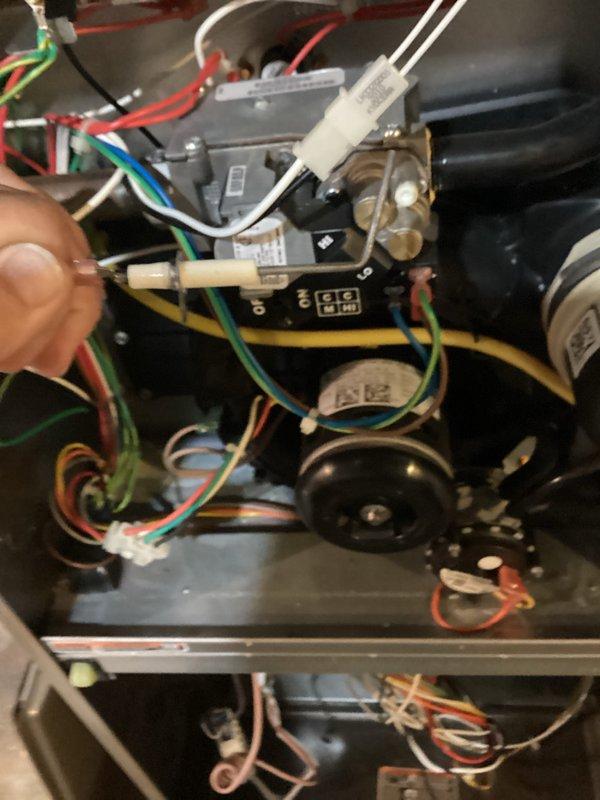 Completed comprehensive tune-up service on both furnace and air conditioning systems. Performed thorough inspection of all internal components including blower motor assembly, gas valve connections, electrical wiring, control board, and refrigerant line fittings. Verified proper operation of heating system with active burner flames, checked all wire connections and terminals for secure contact, and confirmed ventilation piping integrity. Both systems tested and operating within normal parameters.