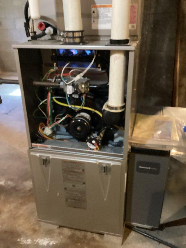 Completed comprehensive tune-up service on both furnace and air conditioning systems. Performed thorough inspection of all internal components including blower motor assembly, gas valve connections, electrical wiring, control board, and refrigerant line fittings. Verified proper operation of heating system with active burner flames, checked all wire connections and terminals for secure contact, and confirmed ventilation piping integrity. Both systems tested and operating within normal parameters.