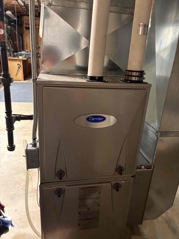 Completed comprehensive tune-up service on Carrier furnace and air conditioning system. Performed full system inspection, cleaning, and testing of both heating and cooling units. Verified proper operation with temperature readings at supply registers showing 584°F at heating outlet, confirming adequate heat output and system functionality.
