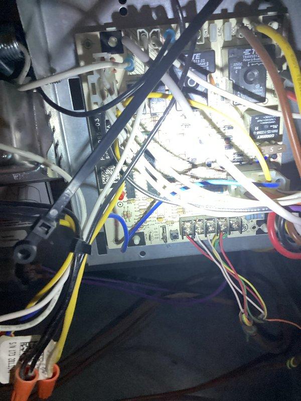 Completed comprehensive furnace and air conditioning tune-up maintenance on residential HVAC system. Inspected and serviced interior control panel components including circuit board, relays, and electrical connections; replaced 20x25x4 air filter as specified. Examined outdoor condensing unit, noting greenish discoloration on aluminum coil fins consistent with environmental exposure, and verified all mechanical components for proper seasonal operation.