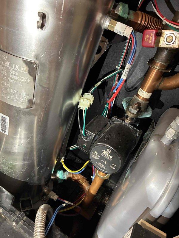 Performed comprehensive tune-up on high-efficiency boiler system, inspecting circulation pump, electrical connections, and associated copper piping for proper operation. Verified all components including expansion tank, pump wiring harnesses, and compression fittings were secure and functioning within manufacturer specifications. System tested and confirmed operating efficiently with no issues detected.