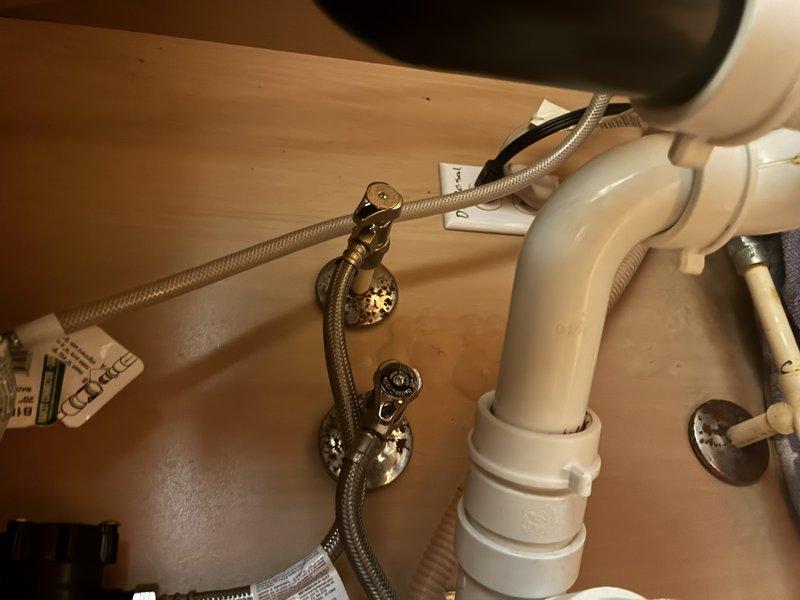 Responded to service call for leaking bathroom sink with faulty shut-off valves. Upon inspection, diagnosed deteriorated angle stop valves showing corrosion and active leaking beneath the sink cabinet. Replaced both hot and cold water supply shut-off valves with new brass angle stops, installed new braided flexible supply lines, and verified all connections were secure and leak-free. Tested system operation and confirmed proper water flow with no further leakage detected.