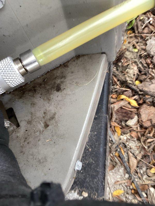 Responded to no cooling call and performed diagnostic evaluation of residential air conditioning system. Connected manifold gauges and vacuum pump to service ports to check refrigerant charge and system pressures. System found to be low on refrigerant, indicating potential leak or undercharge condition requiring further assessment and refrigerant recovery/recharge procedures.