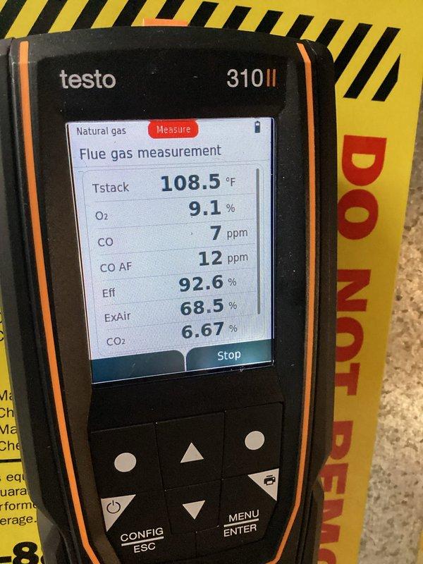Completed furnace tune-up and air conditioning tune-up on residential HVAC system. Investigated reported odd noise coming from coil assembly. Performed comprehensive combustion analysis using flue gas analyzer, which confirmed system operating within manufacturer specifications with 92.6% efficiency, oxygen levels at 9.1%, carbon monoxide at 7 ppm, and stack temperature at 108.5°F. All safety parameters verified and unit returned to normal operation.