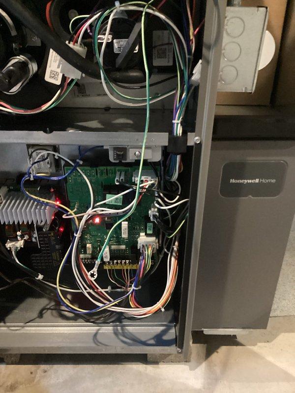 Completed comprehensive seasonal tune-up on Honeywell Home HVAC system including furnace and air conditioning components. Performed full system inspection, verified control board operation with all electrical connections secure and LED indicators functioning properly, checked blower motor assembly, inspected PVC condensate drainage system, and confirmed all ductwork connections are sealed and secure.