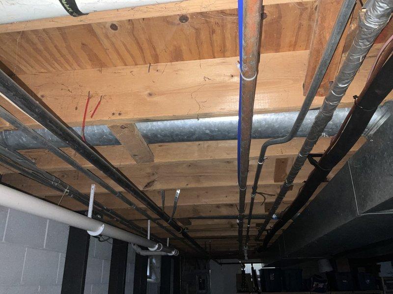 Completed estimate for relocating existing HVAC venting system in unfinished basement area to accommodate new patio door installation scheduled for mid-October. Assessed current ductwork configuration, including flexible and rigid metal ducts running through exposed floor joists, and determined optimal routing to clear the path for the new door opening while maintaining proper airflow and system efficiency.