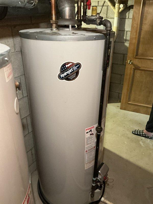 Responded to emergency service call for comprehensive HVAC system evaluation involving furnace with failed heat exchanger requiring gas shutoff, exterior air conditioning unit assessment, and leaking HydroJet water heater with visible moisture at top connections. Conducted thorough inspection of all three units, documented equipment conditions through photography, and prepared complete replacement estimates for furnace, AC system, and water heater as bundled package solution. Coordinated with additional technician to ensure comprehensive evaluation of plumbing and HVAC components for customer requesting multi-system replacement pricing.