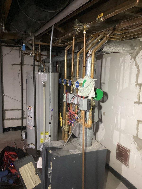 Completed seasonal tune-up on Unico high-velocity A/C system located in attic and mid-efficiency boiler system in basement. Performed comprehensive inspection of boiler components, hydronic piping manifold with zone valves, and verified proper operation of multi-zone heating system to address customer concern regarding uneven room temperatures. Inspected all accessible ductwork, copper supply lines, and mechanical connections; system operating within normal parameters at time of service.