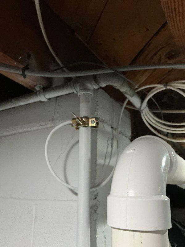 Provided comprehensive plumbing estimate for multiple fixture replacements and repairs involving aging galvanized pipe system. Assessed saddle valve requiring replacement with ball valve due to galvanized pipe concerns, evaluated backyard hose spigot and associated shutoff valve with calcification issues accessible through 46-inch crawlspace with concrete flooring, and inspected non-operational front yard spigot for potential replacement. Documented existing plumbing conditions including PVC and galvanized pipe configurations throughout basement utility areas and exterior hose bib locations to determine scope of necessary repairs and upgrades.