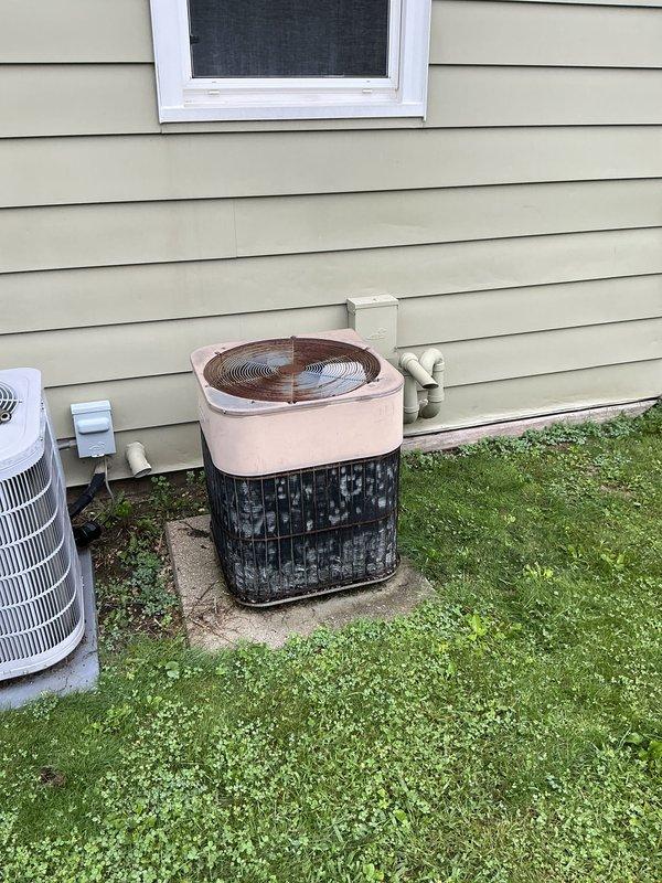 Conducted on-site evaluation for HVAC system replacement estimate. Assessed aging outdoor air conditioning condenser unit with visible weathering and deterioration, along with natural gas furnace located in basement showing advanced age but currently operational. Documented existing equipment conditions through photographic inspection and provided updated pricing options for complete system replacement both through membership warehouse program and standard retail channels.