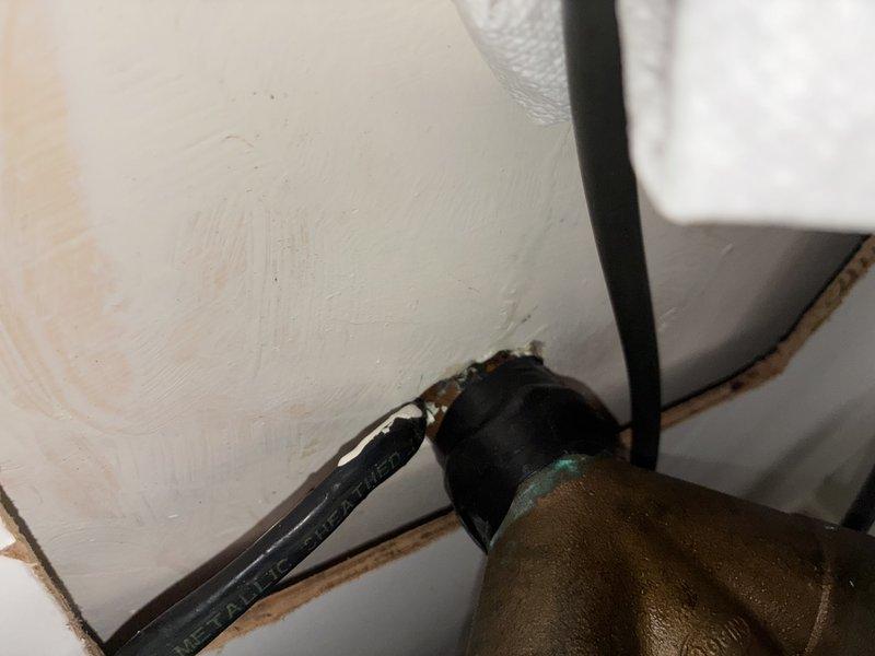 Responded to service call for clogged kitchen sink. Upon arrival, performed thorough inspection of the drain assembly and P-trap configuration beneath the sink. Examined all plumbing connections, including the white PVC P-trap, metal threaded fittings, and associated drainage components. Inspected supply lines, flexible hoses, and electrical connections in the under-sink area. Documented existing plumbing configuration with photographs showing brass fittings, pipe insulation, mounting hardware, and the overall condition of the drainage system. All components were assessed for proper installation, potential blockages, and signs of wear or deterioration.