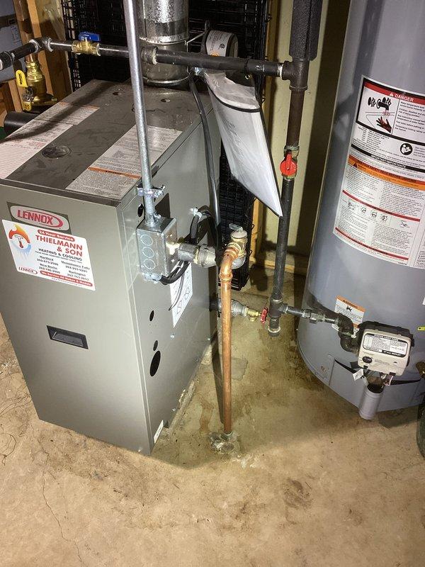 # HVAC Service Report

Responded to service call for leaking pressure relief valve on residential boiler system. Upon inspection, identified active leak at pressure relief valve connection point on copper supply piping. Valve assembly showed signs of deterioration at brass fitting connection. Replaced faulty pressure relief valve with new unit, ensuring proper torque specifications and seal integrity. Tested system operation under pressure to verify leak was eliminated. Confirmed all connections secure and system operating within normal parameters. No further leaks detected upon completion of repair.