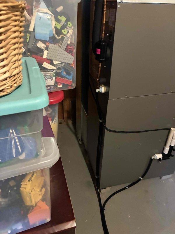 Returned to address inspector's corrections on recent HVAC installation. Documented clearance measurements from front of furnace to wall and replaced temporary cardboard flap on return air plenum with proper sheet metal covering per code requirements.