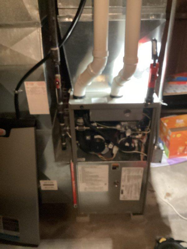 Responded to no heat call on residential furnace system. Upon arrival, confirmed unit was running but producing only cold air. Performed diagnostic inspection and discovered flame sensor rod had excessive oxidation buildup preventing proper flame detection. Removed and cleaned flame sensor, reassembled burner assembly, and tested system operation. Unit now heating properly with burner igniting and flame sensor confirming proper combustion. Verified temperature rise across heat exchanger within manufacturer specifications and confirmed all safety controls functioning correctly.