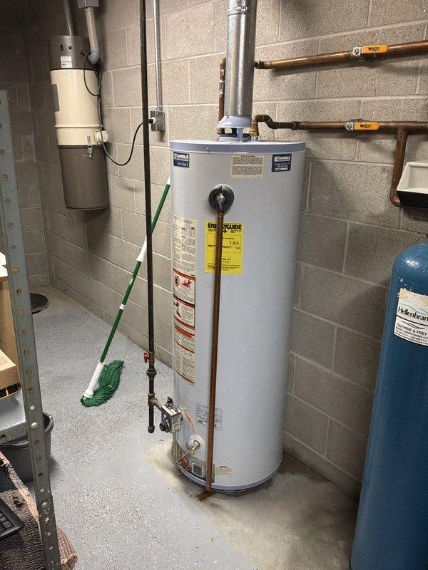 Conducted estimate for replacement of 16-year-old Kenmore model 153.339762 water heater with 48-gallon capacity that is actively leaking. Customer requested upgrade to 60-gallon unit to accommodate increased hot water demand. Assessed existing installation including copper supply lines, exhaust venting, pressure relief valve configuration, and floor drainage. Documented current unit condition with photographs showing leak evidence and utility room layout. Provided recommendations for new water heater installation including proper venting requirements, code-compliant pressure relief valve discharge piping, and expansion tank evaluation.