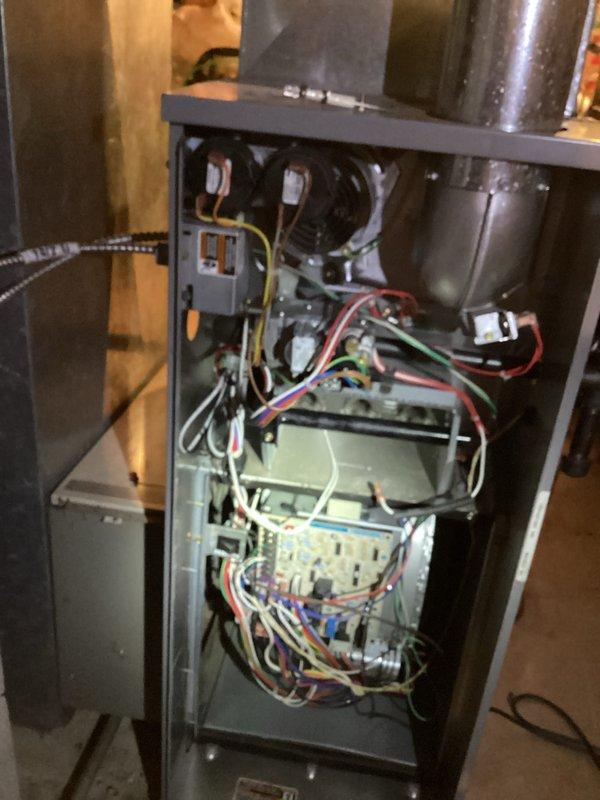 Performed comprehensive tune-up on residential HVAC system for new customer prior to seasonal departure. Conducted thorough inspection of furnace electrical components, control board, and safety devices including thermal fuse testing. Opened cabinet access panel to examine blower motor assembly, transformer, wiring connections, and control circuitry; verified all electrical connections were secure and properly terminated. Recommended scheduling annual maintenance in August for optimal system performance.