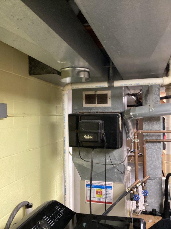 Performed second opinion inspection on Carrier WeatherMaker furnace system following concerns raised by another contractor regarding airflow issues and alleged need for major duct repairs. Conducted comprehensive evaluation of HVAC system including visual inspection of furnace unit, ductwork, Aprilaire humidifier, and air distribution components. Examined all accessible ductwork runs, connections, and plenum assemblies for proper sizing, restrictions, and installation quality. Assessed airflow pathways throughout the mechanical room and verified proper clearances around equipment. Documented equipment specifications and current system configuration with photographic evidence. Found existing duct system and HVAC installation to be adequate with no major repairs required, contrary to previous assessment.