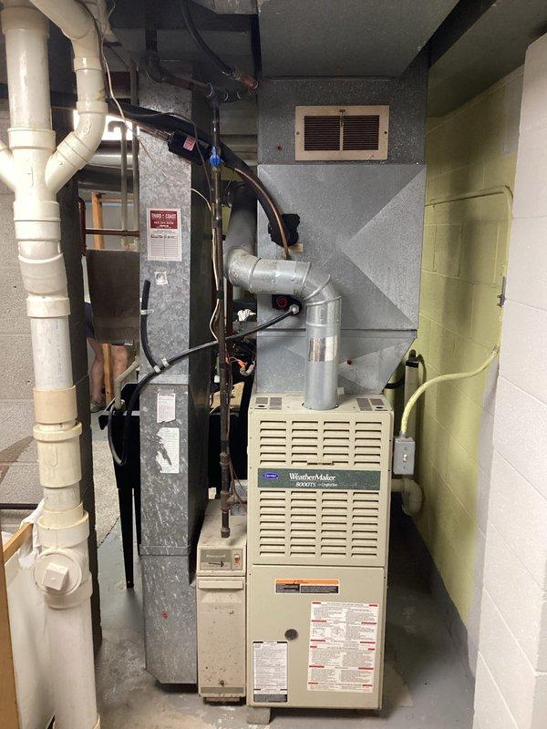 Performed second opinion inspection on Carrier WeatherMaker furnace system following concerns raised by another contractor regarding airflow issues and alleged need for major duct repairs. Conducted comprehensive evaluation of HVAC system including visual inspection of furnace unit, ductwork, Aprilaire humidifier, and air distribution components. Examined all accessible ductwork runs, connections, and plenum assemblies for proper sizing, restrictions, and installation quality. Assessed airflow pathways throughout the mechanical room and verified proper clearances around equipment. Documented equipment specifications and current system configuration with photographic evidence. Found existing duct system and HVAC installation to be adequate with no major repairs required, contrary to previous assessment.