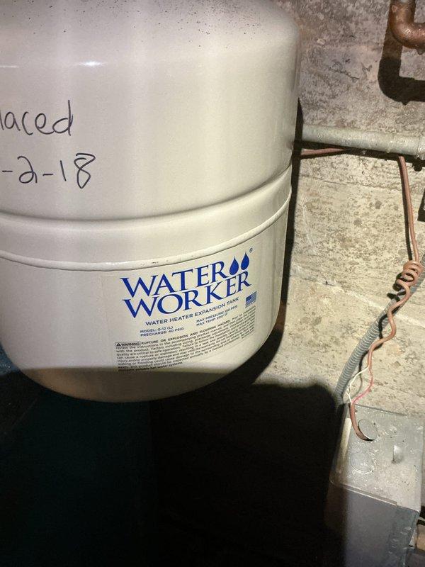 Responded to no heat call for boiler system. Upon arrival, conducted thorough inspection of mechanical equipment and documented existing conditions. Found significant corrosion and rust deterioration on vertical supply piping, with heavy oxidation visible at pipe connections and fittings. Observed water heater expansion tank installed with date marking indicating previous service work. Collected equipment information and photographed corroded components showing advanced deterioration from moisture exposure over time. System evaluation completed and findings documented for further assessment and repair recommendations.