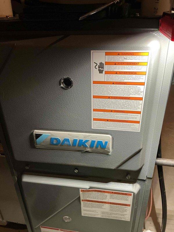 Completed comprehensive heating and cooling system maintenance as part of family membership agreement. Performed full furnace and air conditioning tune-up on Daikin HVAC system, including inspection of all major components, condensate drain pan, float switch assembly, and electrical connections. Documented existing copper pipe corrosion and moisture staining in drain pan area; system operational and functioning within normal parameters at time of service completion.