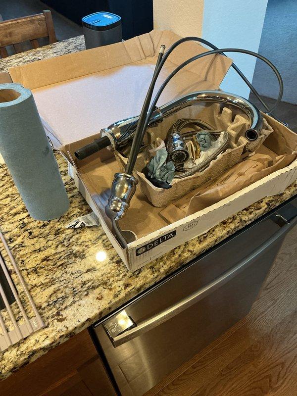 Installed customer-supplied Delta kitchen faucet assembly on granite countertop with undermount sink. Contacted customer prior to arrival as requested, completed installation with all mounting hardware and supply line connections, and verified proper operation and drainage.