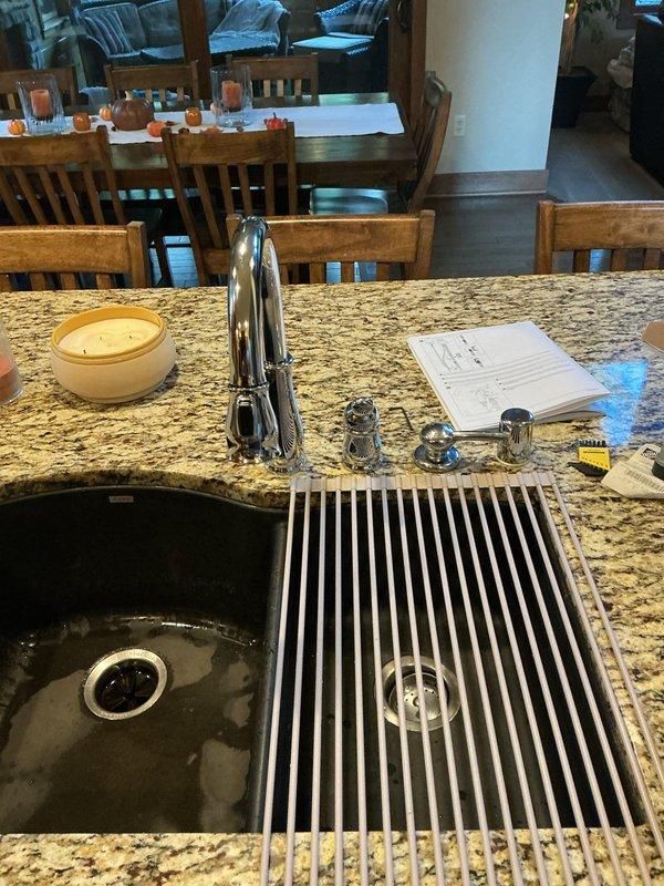 Installed customer-supplied Delta kitchen faucet assembly on granite countertop with undermount sink. Contacted customer prior to arrival as requested, completed installation with all mounting hardware and supply line connections, and verified proper operation and drainage.