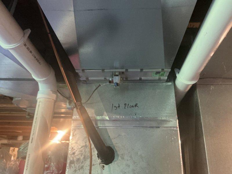 Completed HVAC system service call addressing zoning system components. Replaced AA 700 filter as requested at no charge per prior authorization. Inspected and verified operation of zone panel, three zone dampers, and two thermostats in multi-zone configuration. System components located in basement mechanical space with proper labeling visible on first floor zone identification. All zoning controls and damper operations confirmed functional following service completion.