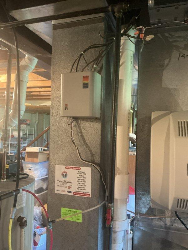 Completed HVAC system service call addressing zoning system components. Replaced AA 700 filter as requested at no charge per prior authorization. Inspected and verified operation of zone panel, three zone dampers, and two thermostats in multi-zone configuration. System components located in basement mechanical space with proper labeling visible on first floor zone identification. All zoning controls and damper operations confirmed functional following service completion.