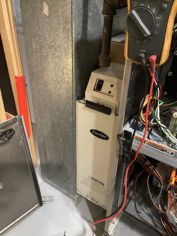Performed no-charge second opinion inspection and equipment assessment of residential furnace system. Documented existing Carrier humidifier installation, ductwork configuration, and associated electrical connections. Collected equipment information and specifications including model numbers and system components for customer records.