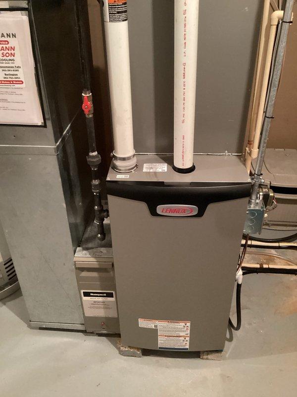 Completed full furnace replacement including installation of new Lennox unit with zoning system upgrades. Installed new zone control panel, zone sensor, three motorized dampers, and AA 600 humidifier to optimize multi-zone climate control. Modified venting system with 3-inch PVC exhaust piping and adapted ductwork connections to existing filter cabinet. Coordinated with licensed electrician for electrical connections and obtained required permit for installation. System tested and verified operational with all zones responding properly to control inputs.