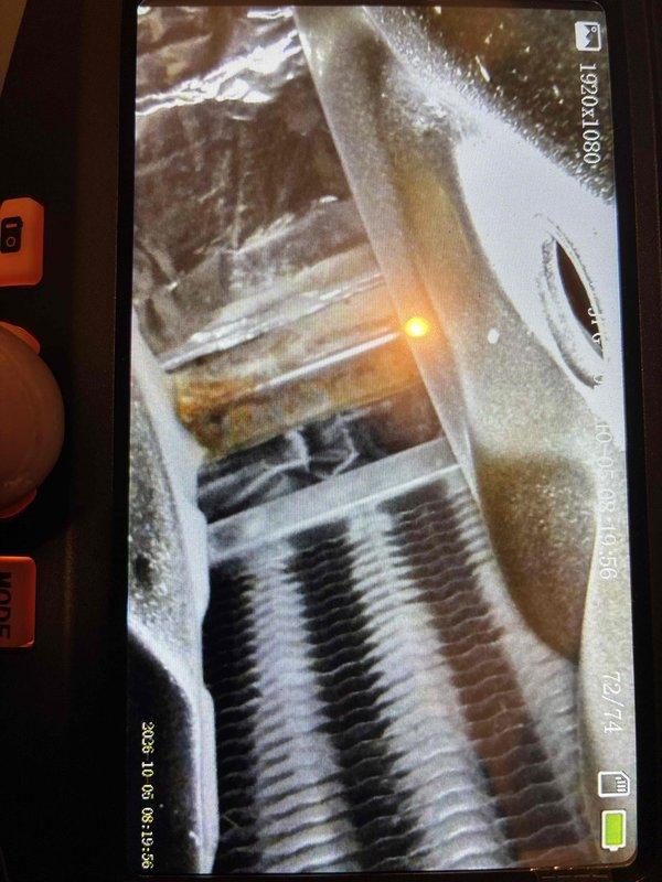 # HVAC Tune-Up Completed

Performed standard tune-up maintenance on residential HVAC system. Discovered evaporator coil heavily covered with frost and ice buildup, indicating abnormal operating conditions. Replaced 16x25x1 air filter as requested. Inspected system components including condensate drain piping, electrical connections, and control panel. Documented equipment condition with photographs showing extensive ice formation on evaporator coil fins and overall system configuration. System requires further diagnostic evaluation to determine root cause of freezing condition, which may include refrigerant charge verification, airflow assessment, or thermostat calibration.