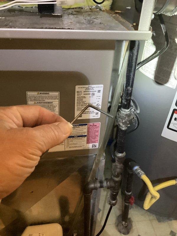 Completed preventive maintenance tune-up on 1-year-old furnace located in basement. Unit is operating properly with no reported issues or symptoms. Performed standard inspection procedures, verified manufacturer specifications and labeling, and inspected condensate trap assembly to ensure proper system function.